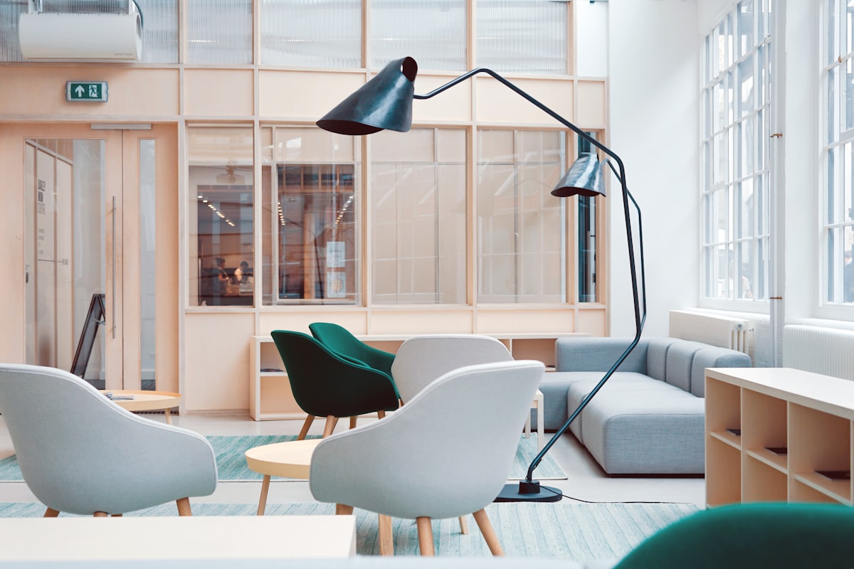A bright, calm modern office interior with a meeting table